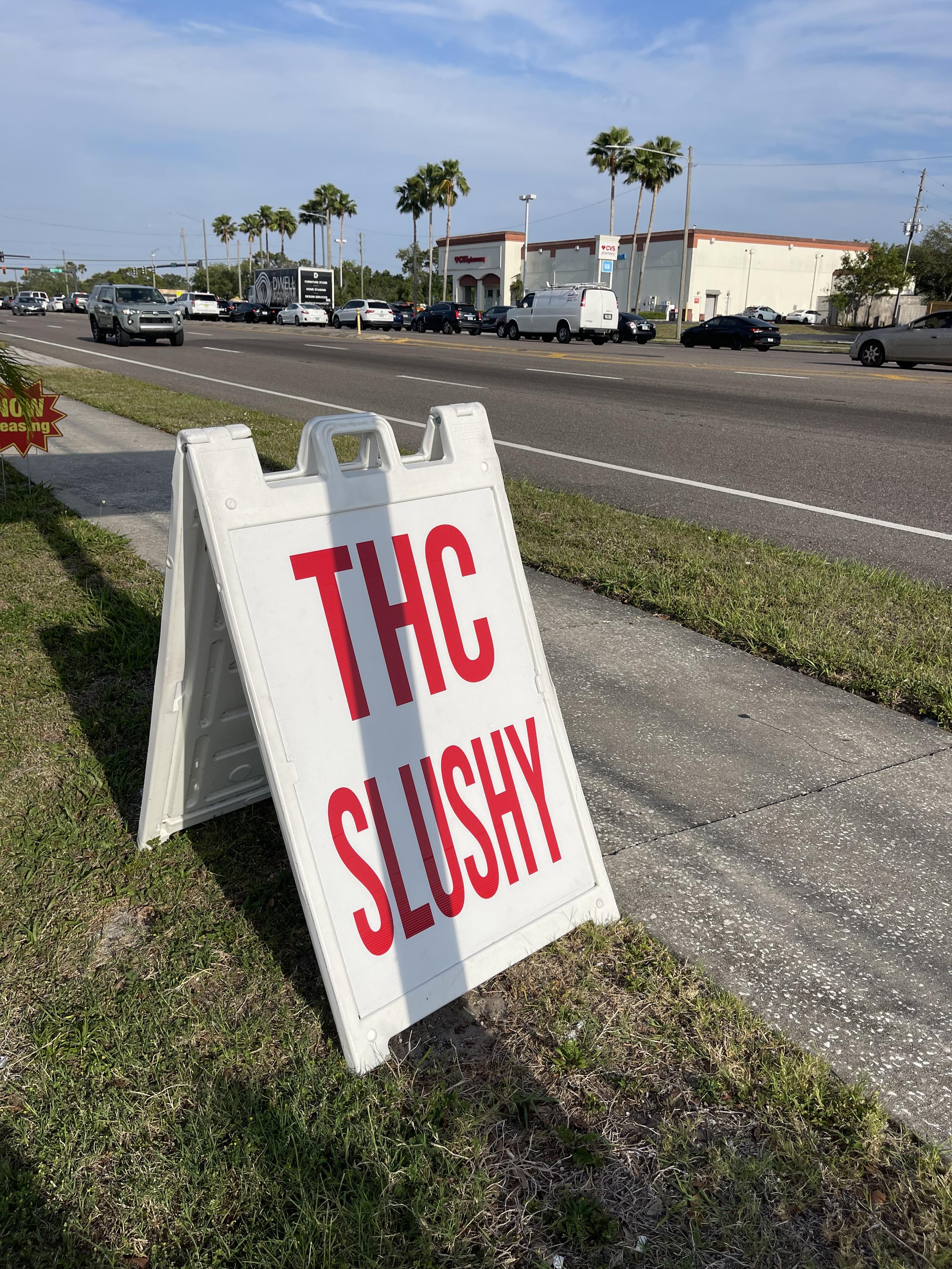 Sandwich board advertising “THC SLUSHY”